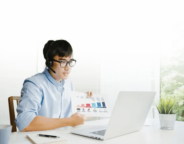 young_asia_businessman_using_laptop_talk_colleagues_about_plan_video_call_while_smart_working_from_home_living_room_self_isolation_social_distancing_quarantine_corona_virus_prevention_sao_chep_min_a0c