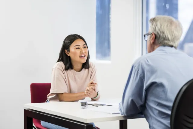 femaletesttakerduringanieltsspeakingtestwithanexaminer-1728961482935769110846