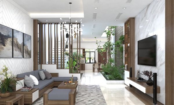 Điểm xuyết phụ kiện trang trí mộc mạc và cây xanh tạo chiều sâu cho phòng khách