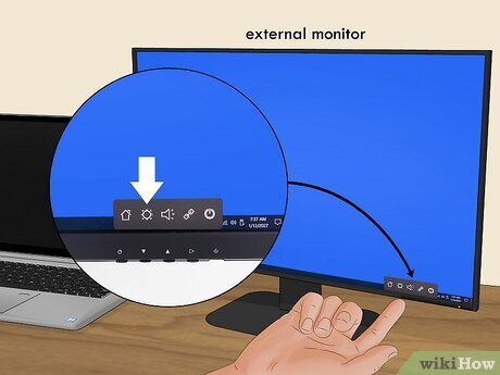 Dùng nút vật lý trên màn hình ngoài để chỉnh độ sáng