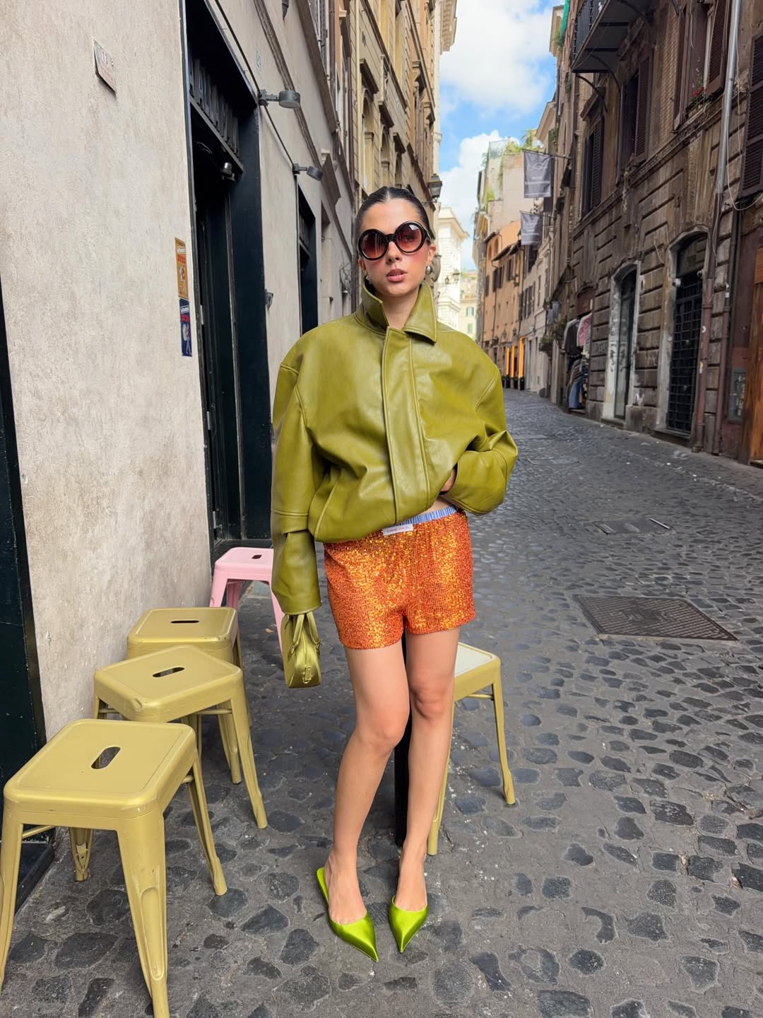 Áo da xanh rêu phối shorts sequins cam cháy mang tinh thần high-fashion