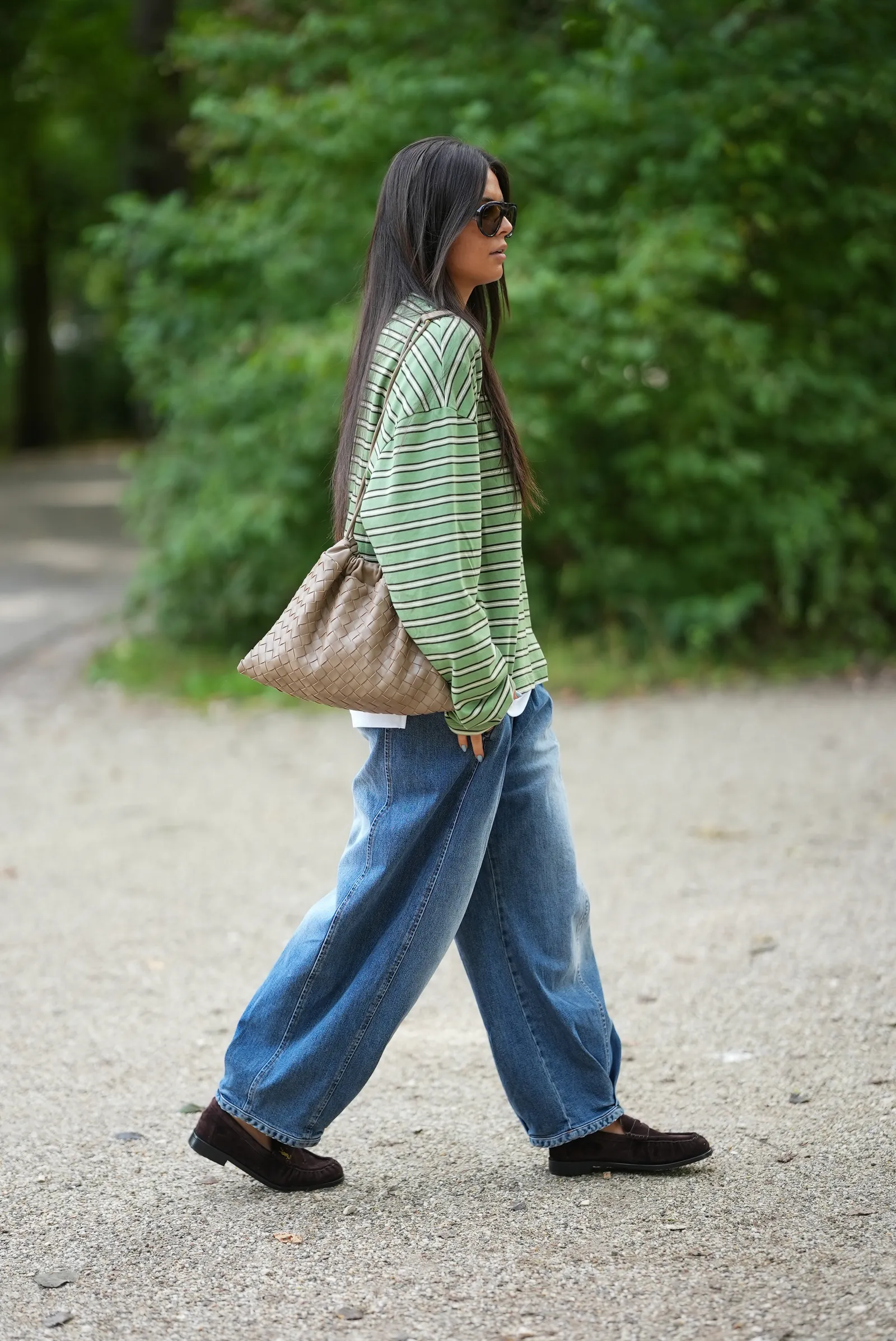 AMSTERDAM NETHERLANDS  SEPTEMBER 2 Saar Goedegebuur wears an oversized green striped HM long sleeve top layered over a...