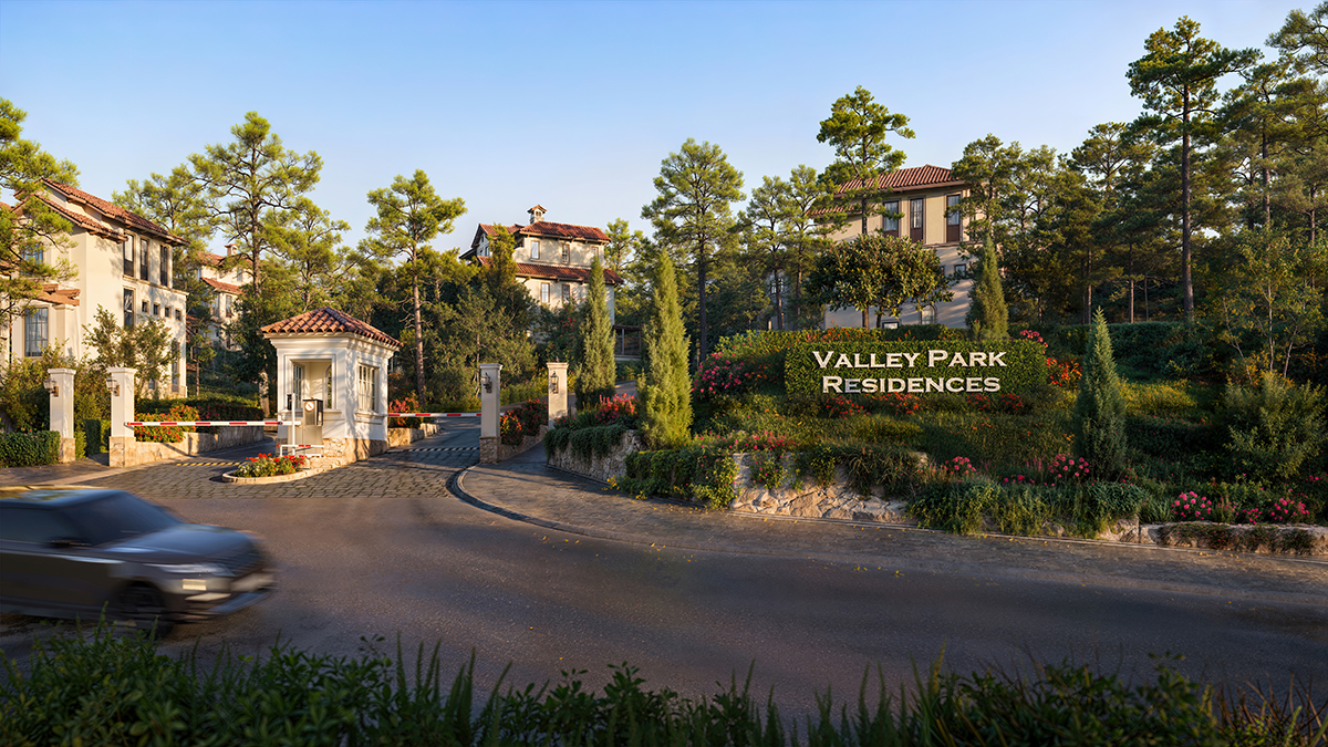 Cổng vào khu Thanh Xuan Valley với hàng thông xanh mát dẫn vào không gian sống yên tĩnh