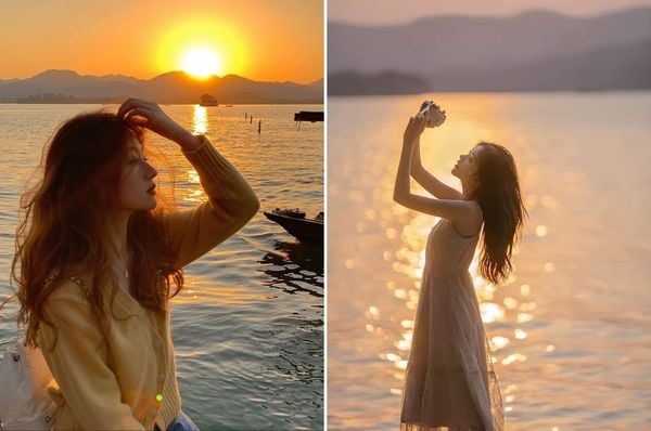 Đưa tay lên cao trước hoàng hôn