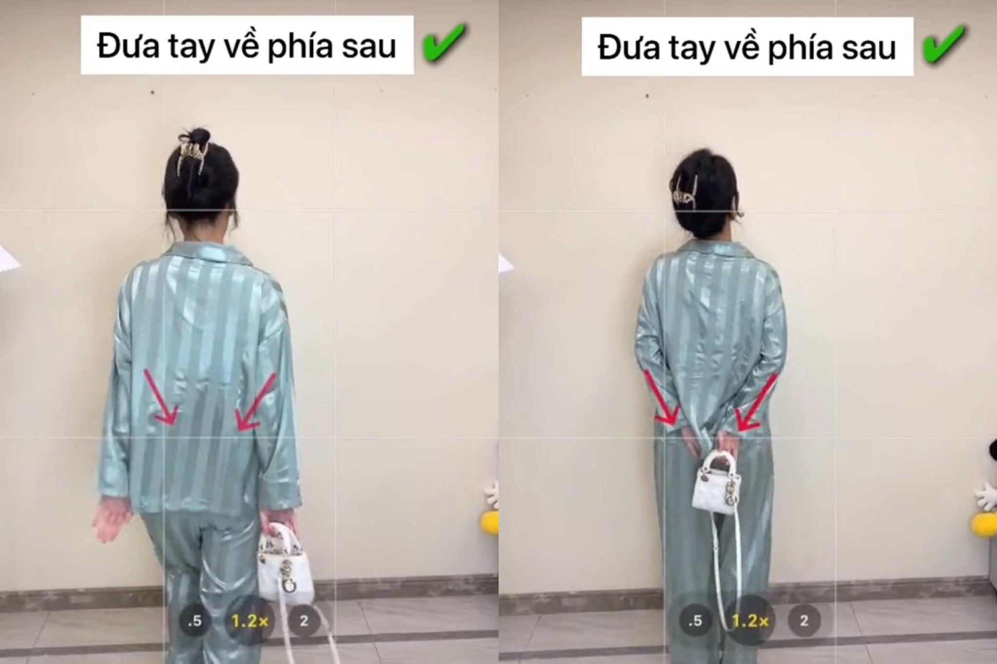 Giả vờ bước đến và đưa tay và túi ra sau như đang thưởng thức tranh (Nguồn: Douyin)
