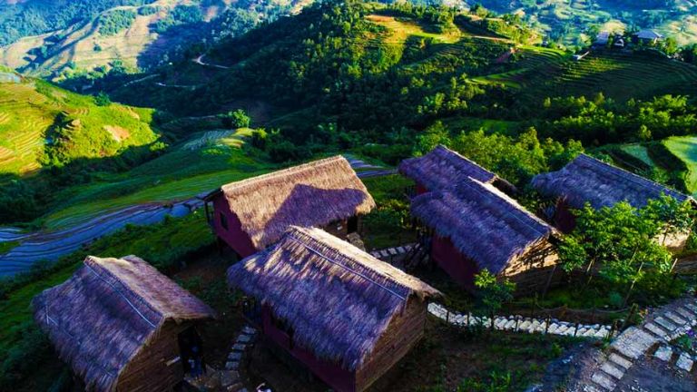 Community homestay in Ban Ho village near Sapa with local H'Mong family preparing traditional meal