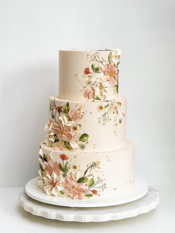 Elegant multi-tiered wedding cake with floral decoration