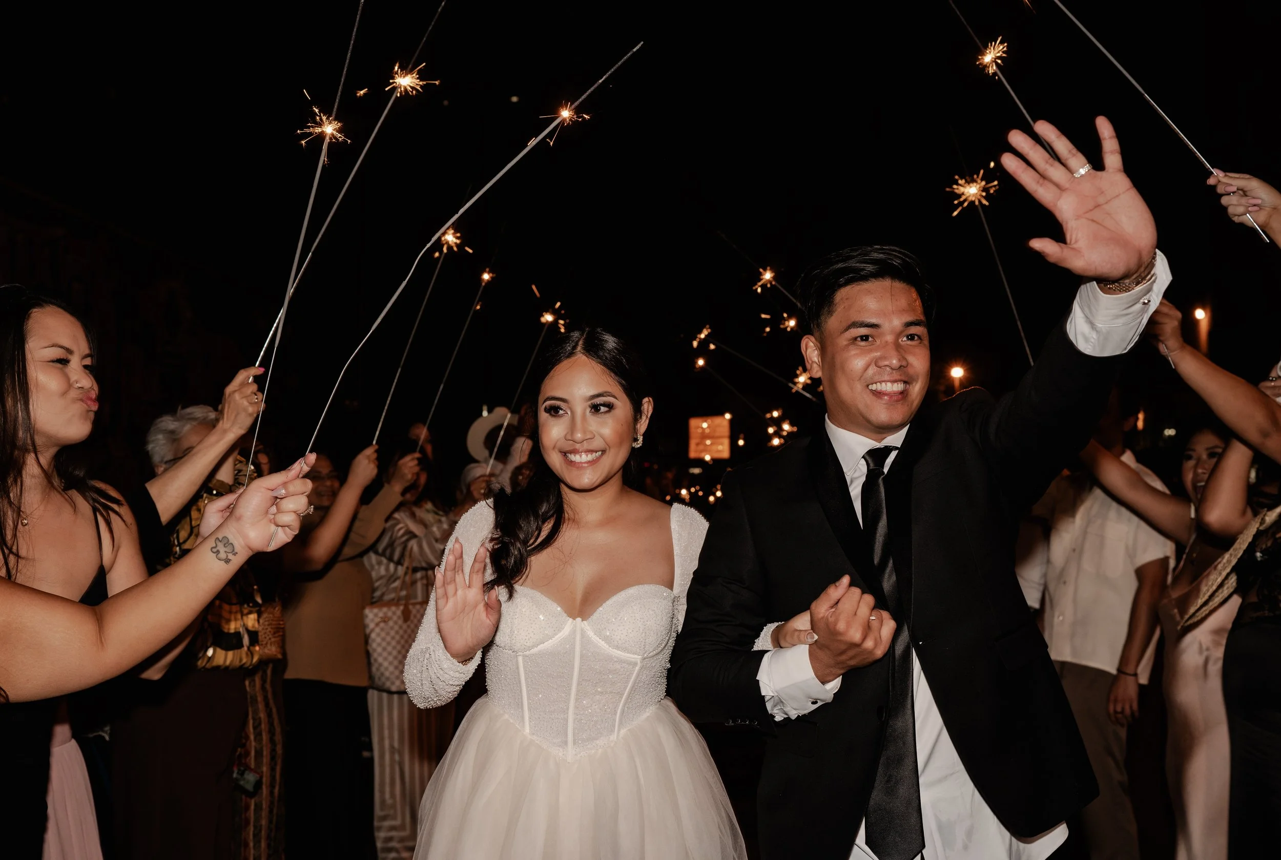 Wedding planner and couple reviewing wedding timeline and checklist together