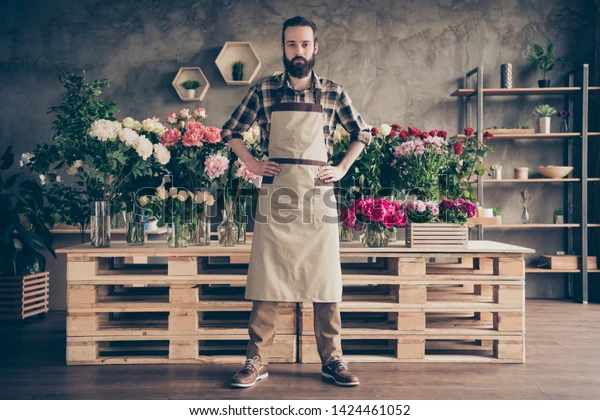 Wedding planner organizing vendor list and timeline on laptop at desk