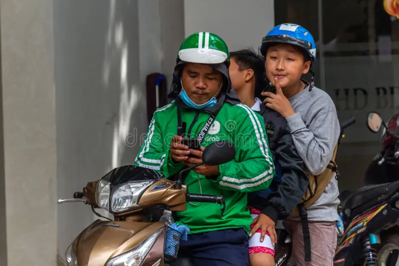 Grab motorbike taxi app Vietnam city street