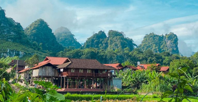Climbers at Huu Lung limestone crag with local community homestay background