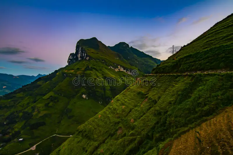 Panoramic view of Ma Pi Leng pass winding through limestone cliffs above Nho Que River