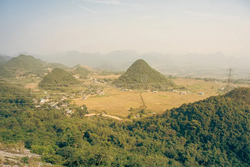 Mai Chau valley with Thai stilt houses rice fields and mountains in Hoa Binh province