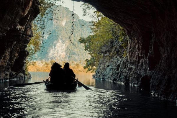 Trang An boat tour through limestone caves and karst landscape in Ninh Binh