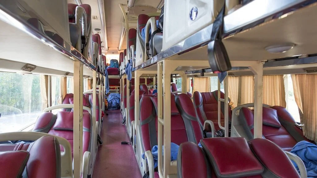 Night sleeper bus interior Vietnam with reclining pods for long-distance travel