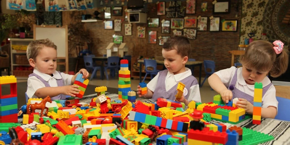 Children learning through play with colorful educational toys
