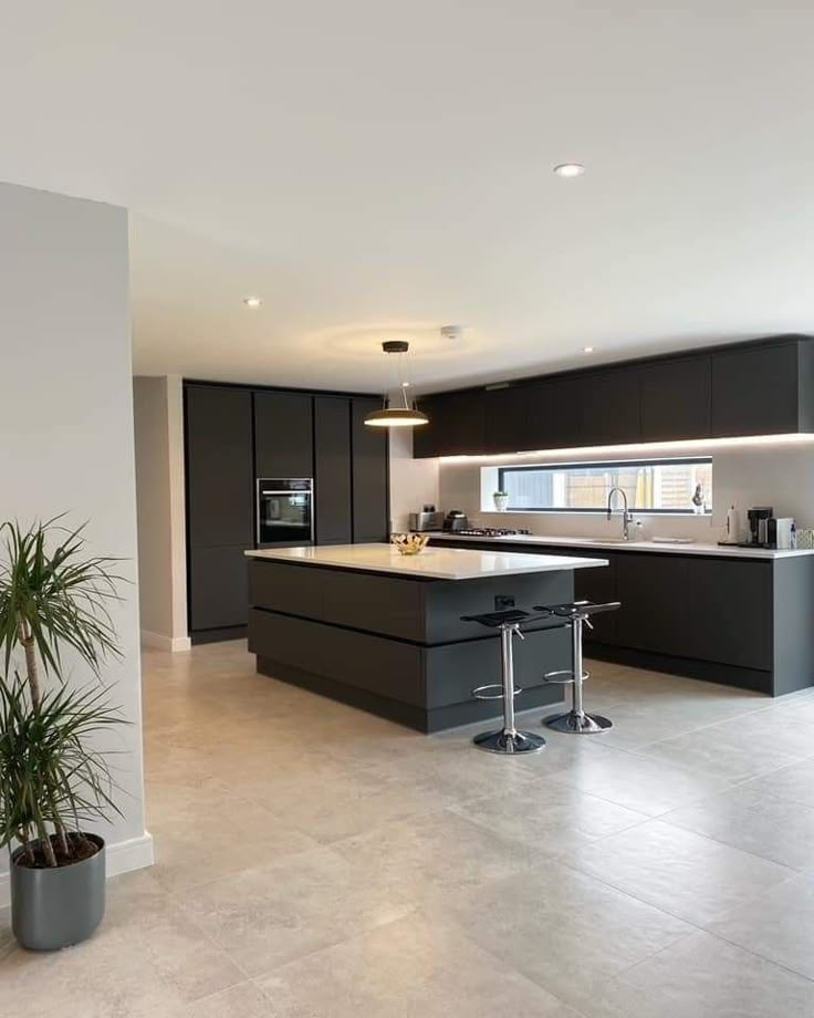 Open concept kitchen design with natural wood and dark tones 2026